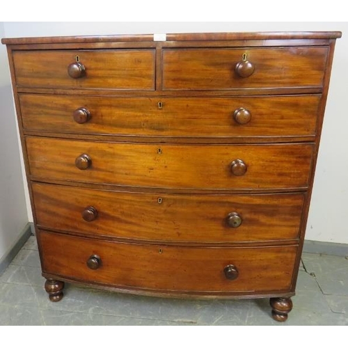 714 - A Georgian mahogany bow-fronted chest of two short over four long graduated cock-beaded drawers with... 