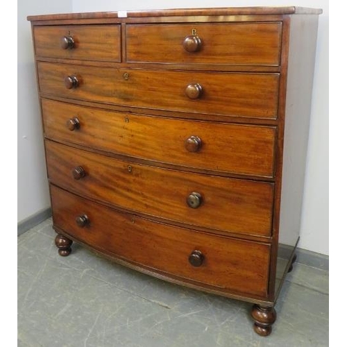 714 - A Georgian mahogany bow-fronted chest of two short over four long graduated cock-beaded drawers with... 