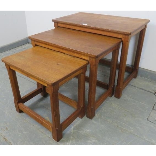 718 - A vintage medium oak Mouseman set of three graduated nesting tables by Robert Thompson, on chamfered... 