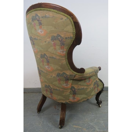 722 - A Victorian mahogany show-wood armchair, featuring carved acanthus scrolls, upholstered in golfing i... 