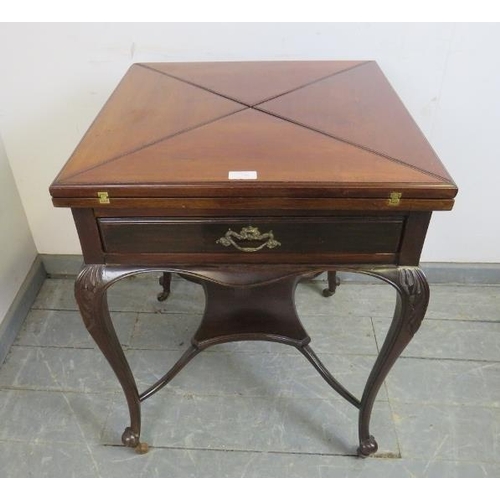 736 - An Edwardian Georgian Revival mahogany envelope card table, the drawer with ormolu handles, on cabri... 