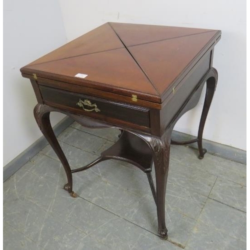 736 - An Edwardian Georgian Revival mahogany envelope card table, the drawer with ormolu handles, on cabri... 