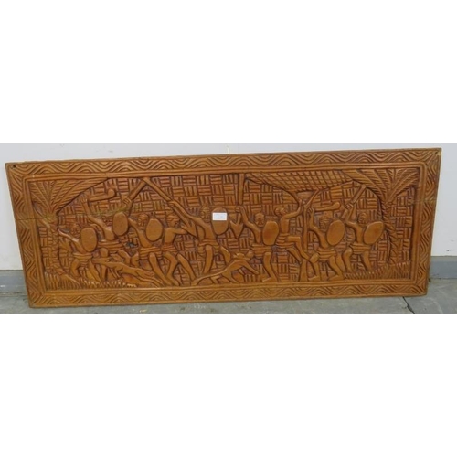 738 - A vintage African teak wall-mounted frieze panel, with relief carving depicting figural motifs. 
H42... 