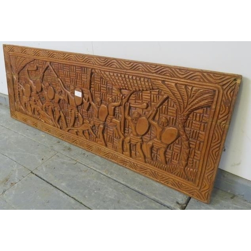 738 - A vintage African teak wall-mounted frieze panel, with relief carving depicting figural motifs. 
H42... 