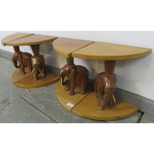 739 - Four vintage teak nesting tables with carved bases in the form of elephants. 
H33cm W22cm D23cm (app... 