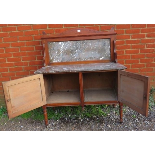 741 - A turn of the century mahogany washstand with marble top and splashback and cupboard under, on turne... 