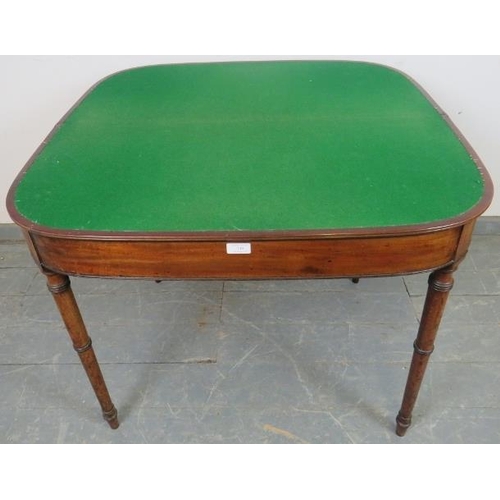 749 - A George III mahogany turnover card table, with reeded edge, on tapering turned supports. 
H71cm W91... 