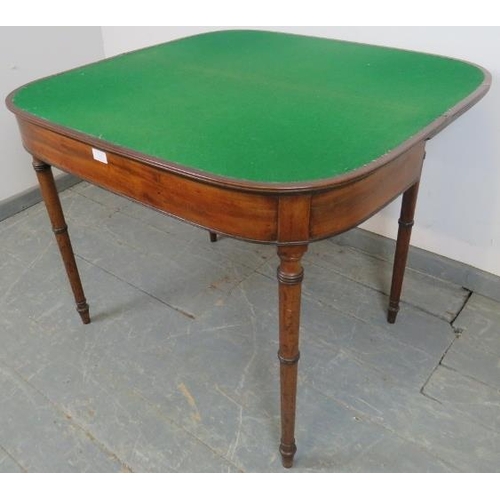 749 - A George III mahogany turnover card table, with reeded edge, on tapering turned supports. 
H71cm W91... 