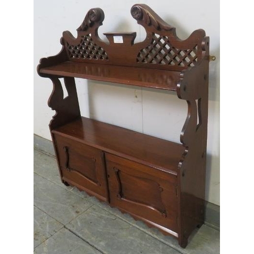 752 - Victorian mahogany wall-hanging shelf unit, with acanthus carved, scrolled and pierced cornice, abov... 