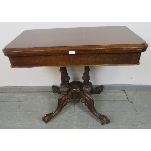 756 - A Victorian oak and mahogany turnover card table, with green baize and two blind drawers under, over... 