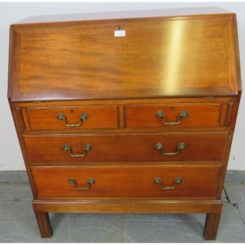 759 - A mid-century teak bureau by Gordon Russell, the cross-banded fall front opening onto filled shelves... 