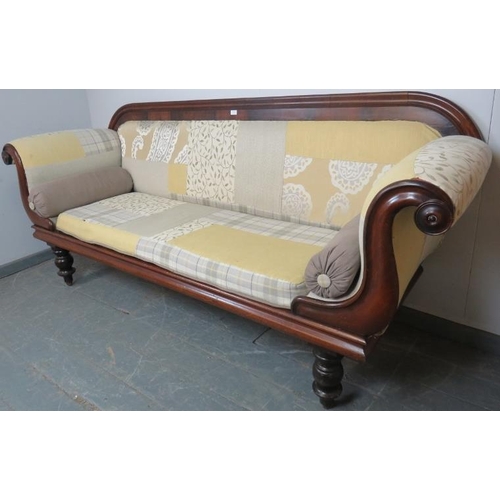 760 - A Victorian mahogany show-wood sofa, with scrolled arms, reupholstered in contemporary patchwork mat... 