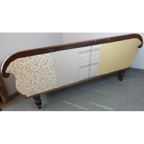 760 - A Victorian mahogany show-wood sofa, with scrolled arms, reupholstered in contemporary patchwork mat... 