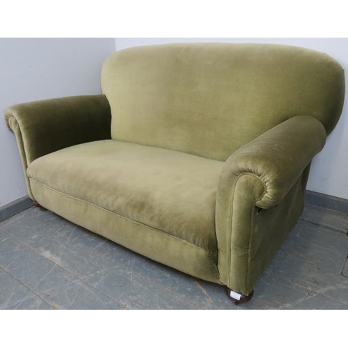 772 - An Edwardian drop-end sofa of small proportions, re-upholstered in green velvet material, on bun fee... 