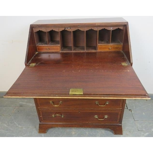 775 - An Edwardian mahogany bureau of small proportions, strung with satinwood and ebony, the fall-front o... 