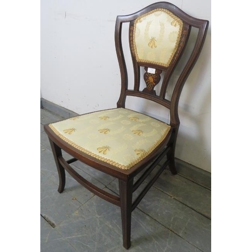 778 - An Edwardian mahogany bedroom chair, with marquetry inlay and strung with satinwood, upholstered in ... 