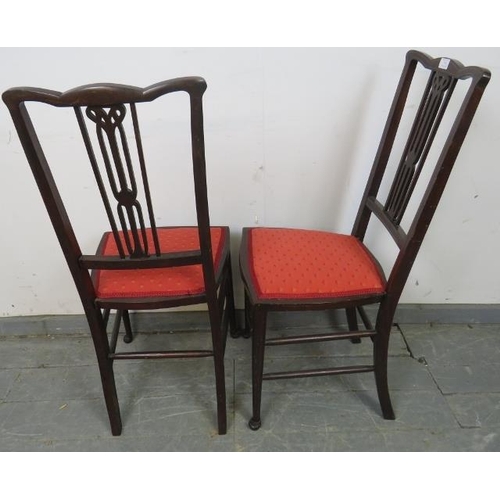 779 - A pair of Edwardian mahogany side chairs, strung with satinwood, the seats upholstered with scarlet ... 