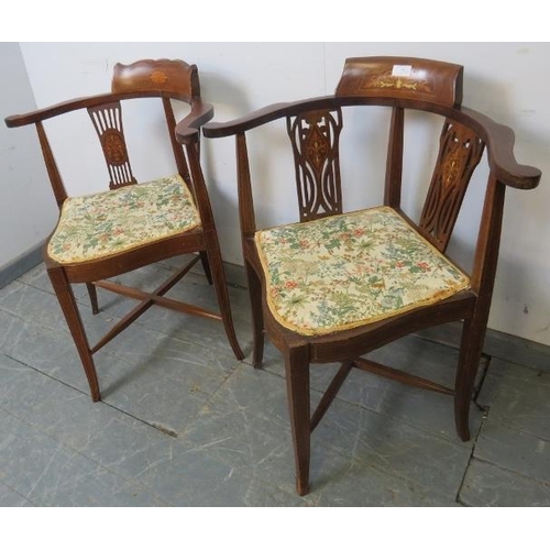 780 - A pair of Edwardian mahogany corner chairs, with pierced backs and marquetry inlay, upholstered in w... 