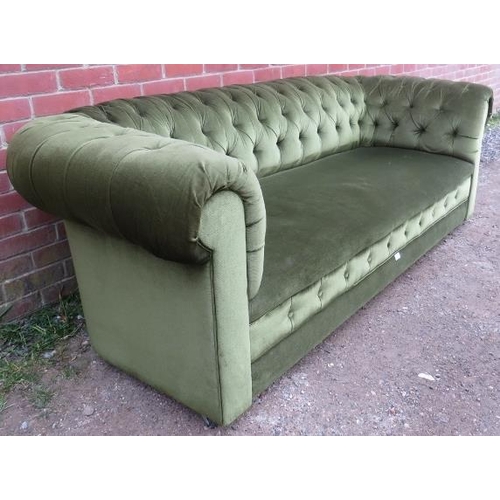 785 - A vintage three-seater Chesterfield sofa, upholstered in buttoned olive green cut corduroy, on casto... 