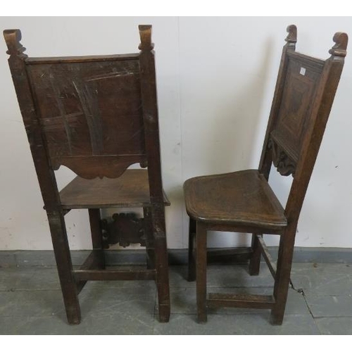 786 - A pair of 17th century and later cherrywood Tyrolean his and hers inlaid hall chairs, the back panel... 