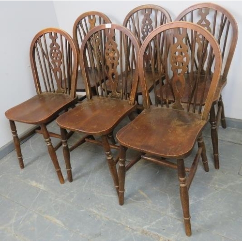 792 - A set of six vintage elm and beech wheel-back dining chairs, on turned canted supports with an ‘H’ s... 