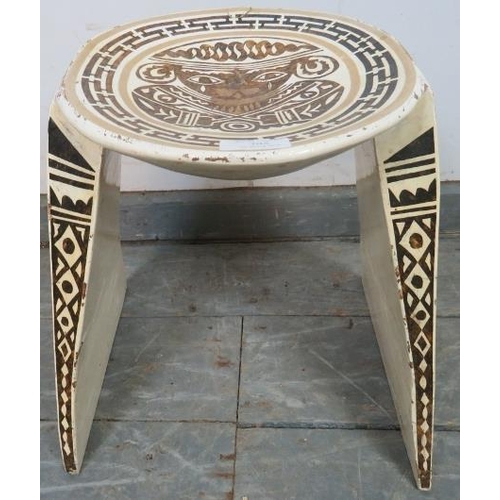 795 - A vintage Colombian wooden stool, with dished top, on triangular supports, hand-painted in white, br... 