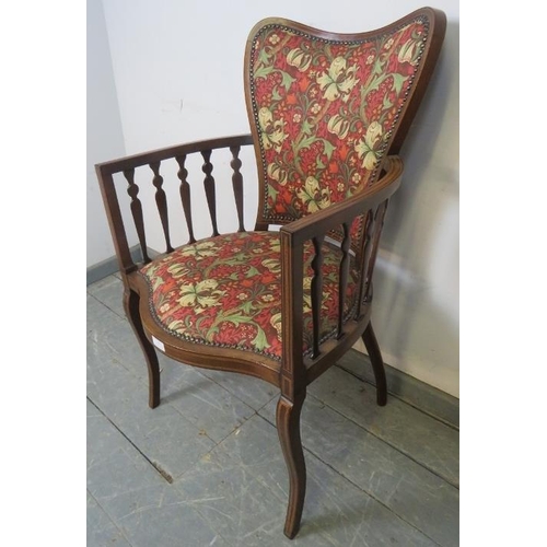 797 - An Art Nouveau mahogany elbow chair, strung with satinwood and parquetry inlay, with shaped spindles... 