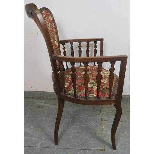 797 - An Art Nouveau mahogany elbow chair, strung with satinwood and parquetry inlay, with shaped spindles... 