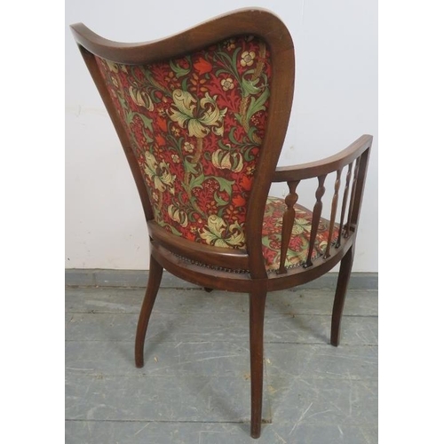 797 - An Art Nouveau mahogany elbow chair, strung with satinwood and parquetry inlay, with shaped spindles... 