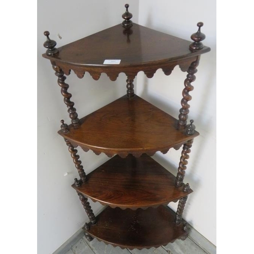 801 - A Victorian rosewood four-tier corner whatnot, with barley twist uprights and turned finials, each s... 