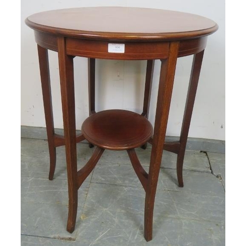 804 - An Edwardian mahogany circular two-tier occasional table strung with satinwood, on tapering square s... 