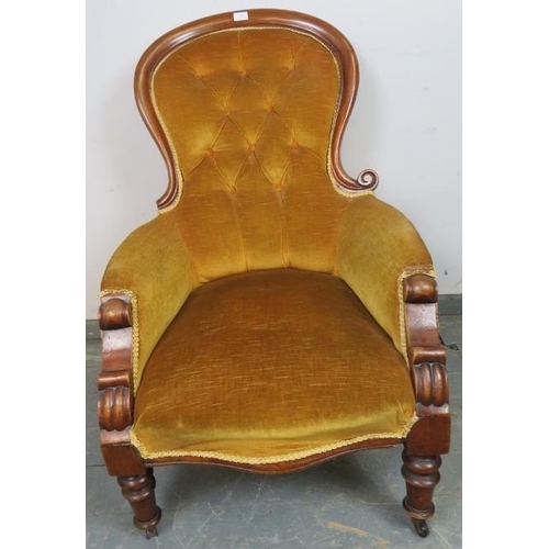 805 - A Victorian mahogany spoonback chair, upholstered in gold buttoned material with braid trim, on tape... 