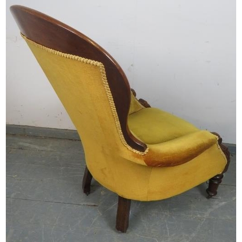 805 - A Victorian mahogany spoonback chair, upholstered in gold buttoned material with braid trim, on tape... 