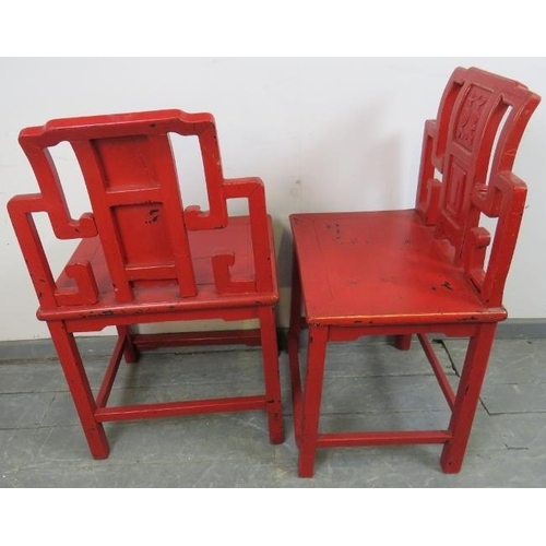 806 - A set of four early 20th century Chinese cinnabar dining chairs in red lacquer with gold accents, fe... 