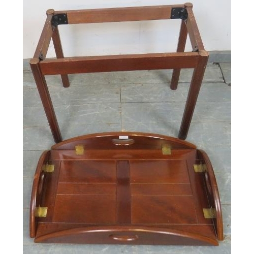 808 - A reproduction Georgian-style mahogany butler’s tray table, the tray with folding sided and brass hi... 