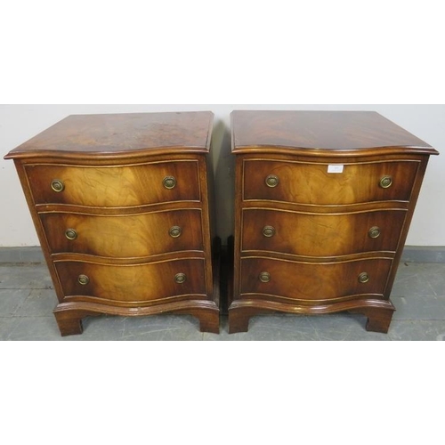 809 - A pair of reproduction Georgian-style flame mahogany serpentine fronted bedside chests, each housing... 