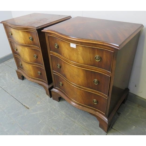 809 - A pair of reproduction Georgian-style flame mahogany serpentine fronted bedside chests, each housing... 