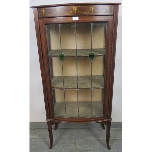 814 - An Edwardian mahogany bow fronted glazed display cabinet, with marquetry inlay and strung with satin... 