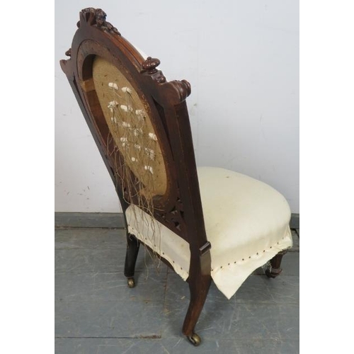 819 - A Victorian mahogany bedroom chair, with fluted bun finials and acanthus carved and pierced back, on... 