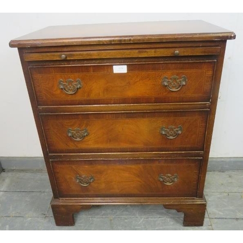 824 - A reproduction mahogany bachelor’s chest, crossbanded and strung with satinwood and ebony, with pull... 