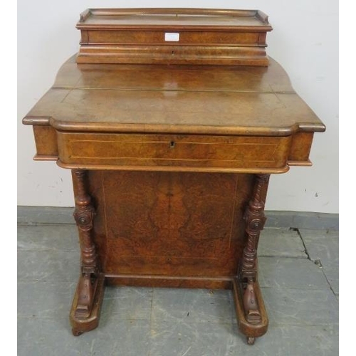 831 - A Victorian burr walnut Davenport, the raised gallery with fitted stationary compartment, above a sl... 