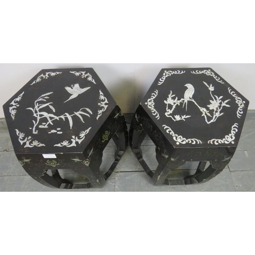 836 - A near pair of vintage Chinese black lacquer barrel stools, the tops with mother of pearl inlay depi... 