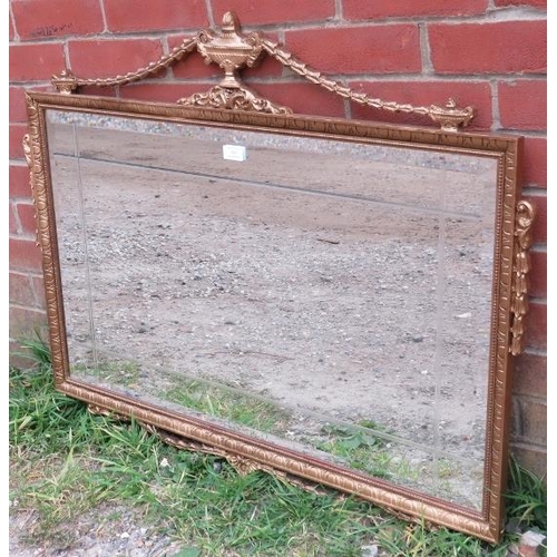 837 - A rectangular giltwood bevelled and sectioned wall mirror in the Neo-Classical taste, the carved cor... 