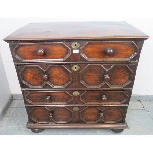 839 - An  antique Jacobean-style elm chest of four long graduated drawers with geometric mouldings and bra... 