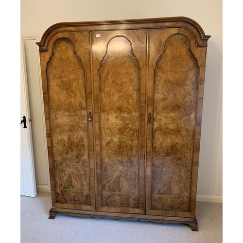 843 - A 1920s burr walnut bedroom suite comprising a double bed, triple wardrobe, compactum, bedside cabin... 