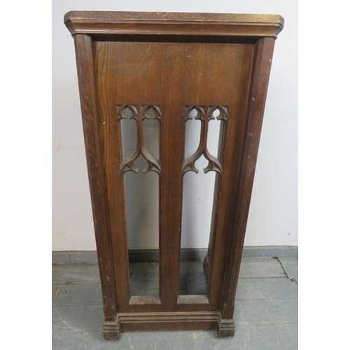 846 - A vintage oak lectern in the Gothic Revival taste, with carved and pierced front, on chamfered suppo... 