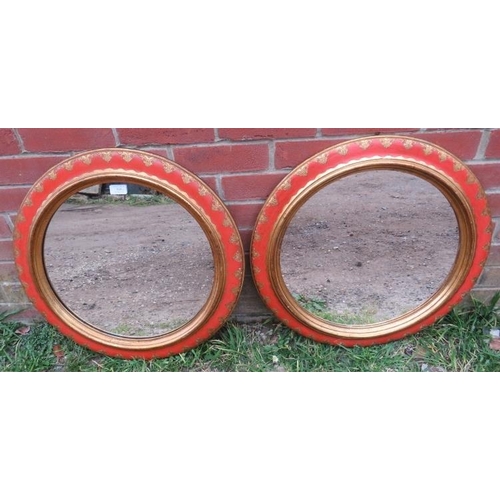 848 - A pair of  good decorative vintage circular wall mirrors in red lacquer and parcel gilt surrounds. 
... 