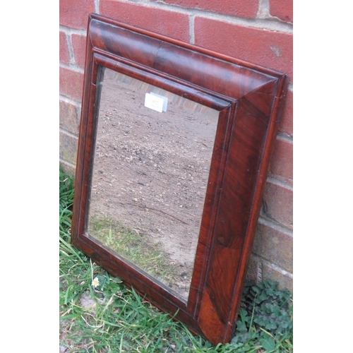 852 - A late 17th/early 18th century walnut oyster veneered cushion mirror with bevelled plate. 
H46cm W41... 