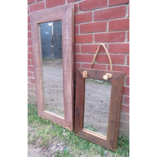 859 - Two rectangular wall mirrors in weathered oak surrounds. 
H110cm W49cm D3cm (approx).
Condition repo... 