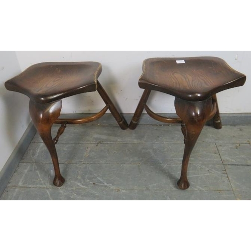 870 - A pair of Georgian style oak three-legged stools, on cabriole front supports and canted rear support... 